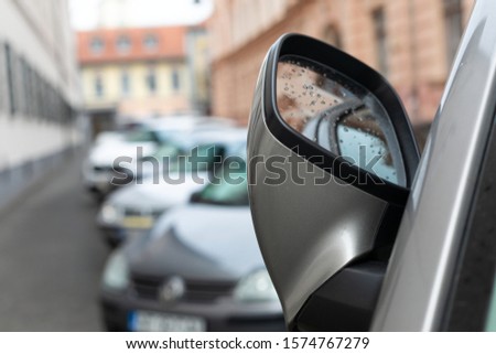 Scenic picture of a street in Sibiu medieval center, cars parked along the road