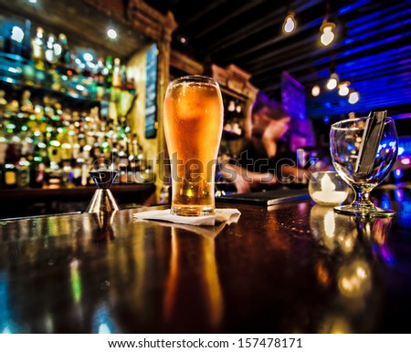 Pint of beer on a bar in a traditional style pub  Royalty-Free Stock Photo #157478171
