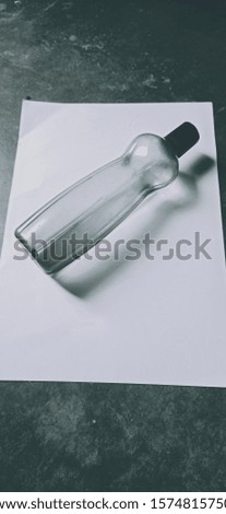 water bottle on a paper