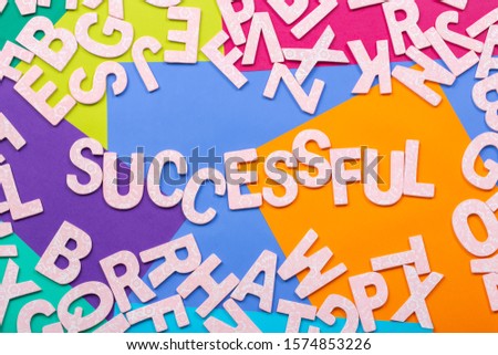 Lots of Alphabets on colorful background with the word Successful