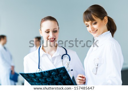 image of two doctors discuss the x-ray image, teamwork