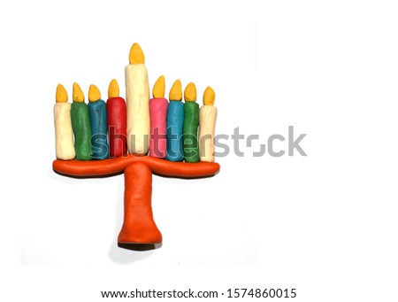 Chanukia from plasticine of different colors. Hanukkah. Jewish holiday