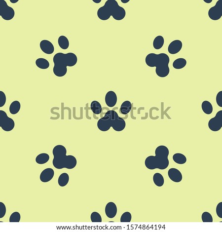 Blue Paw print icon isolated seamless pattern on yellow background. Dog or cat paw print. Animal track.  Vector Illustration