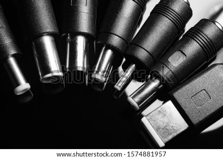 Several electro connectors on a black background shot in macro mode. Visible metal connectors of connectors.