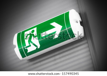 green emergency exit sign