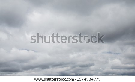 Close-up of a completely grey cloudy sky Royalty-Free Stock Photo #1574934979