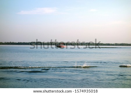 Sport activity on the lake in the summer season