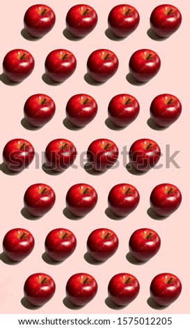 Red apples pattern with pink background
