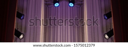 Lighting and spotlights, stage light in a theater above the stage. Texture background for design.