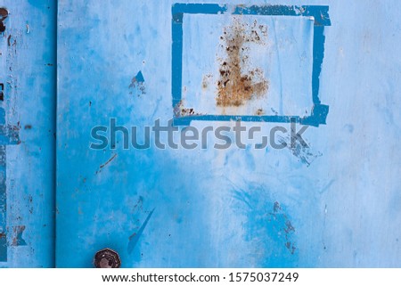 Background. Shabby metal door in blue.