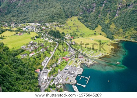 Scenic aerial view of Geiranger village and coastline of the fjord, Norway, summertime