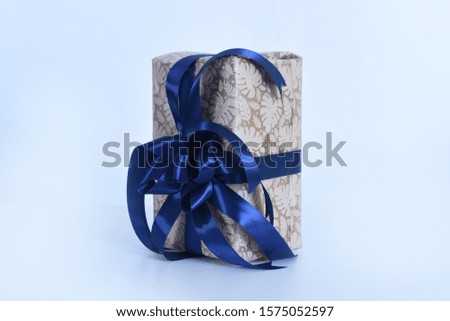 A Christmas gift box blue ribbon