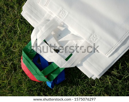 isolated white handle loop Non Woven Polypropylene Bags, Eco Friendly Bags, Reusable bag, Shopping & Gift Bags, Environment Friendly Concept,