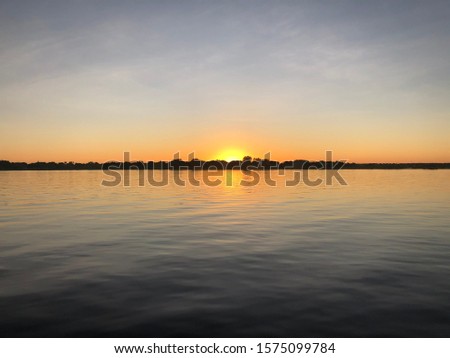 Sunset on Lake Hancock, FL Royalty-Free Stock Photo #1575099784