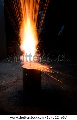 Burning fire crackers on the occasion of Diwali festival.