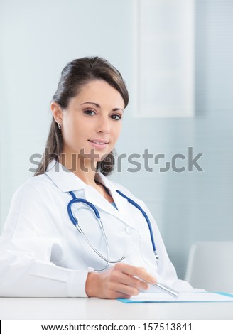 Portrait of a confident woman doctor sitting in her office