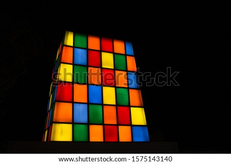 beautiful abstract of exterior view of illuminated colored window glass tower, low light photography chennai mall india tamil nadu