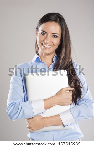 Successful business woman is standing on isolated background.
