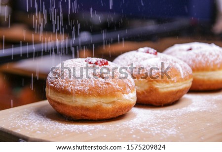 Hanukkah food doughnuts with jelly and sugar powder with bookeh background. Jewish holiday Hanukkah concept and background. Copy space for text. Shallow DOF