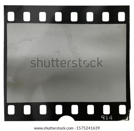 empty filmstrip on white background with dust and scratches