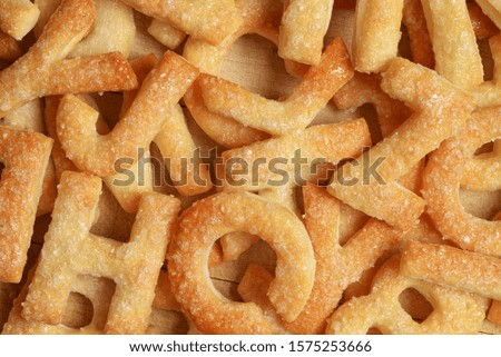 Heap of letters made with cookie or biscuit. Can be used as background