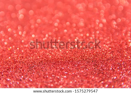Defocused red glitter background. Gold abstract bokeh background. Christmas abstract background
