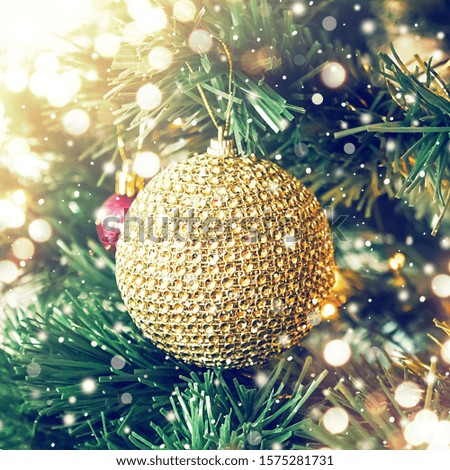 Christmas golden ball on fir brunches, Christmas and New Year holiday background.