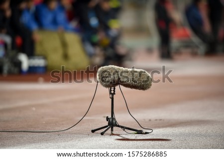 Professional boom microphone on a soccer stadium during a match