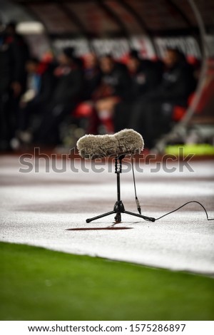 Professional boom microphone on a soccer stadium during a match