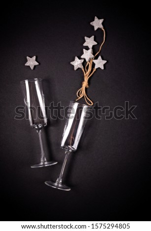 Two glasses with wooden tar decoraion with rope, flat lay, celebration concept