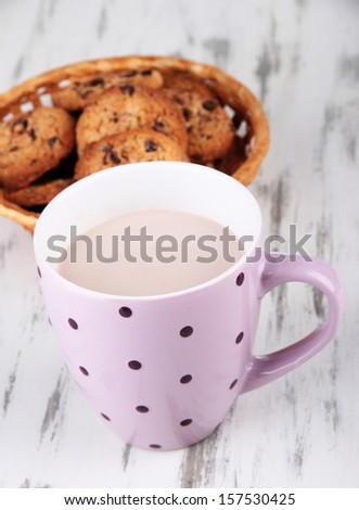 Cocoa drink and cookies on wooden background