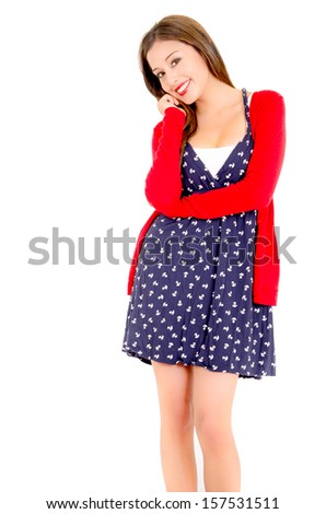 Happy Young woman in dotted dress and sweater on a white background
