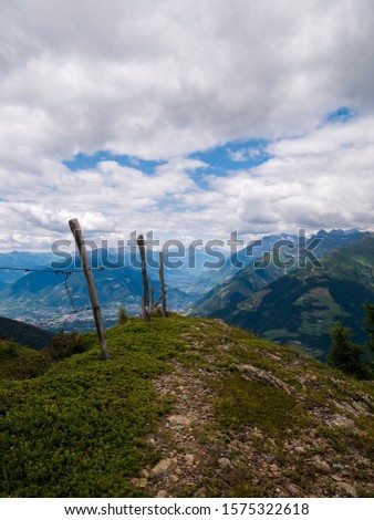 Scenic view from the Mountain Peak im south tyrol into the Valley 