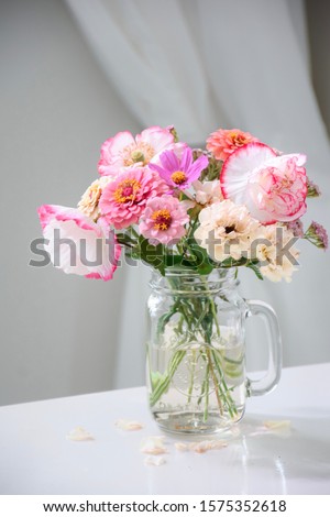 Garden flowers in a mason jar glass vase