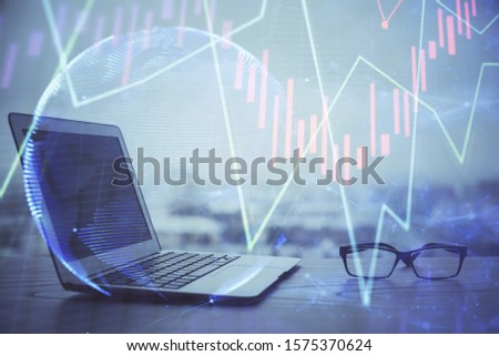 Forex Chart hologram on table with computer background. Multi exposure. Concept of financial markets.