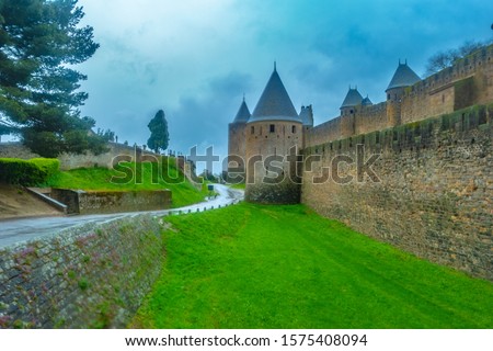 Castle of Carcassonne, France. Medieval Carcassone town view, France. Gloomy castle in rain.