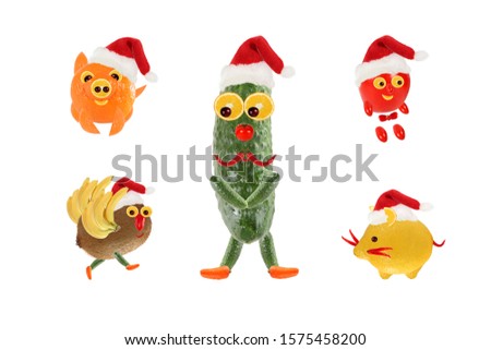 Creative food concept. Funny vegetables and fruits as a Santa Clauses. Happy New Year.
