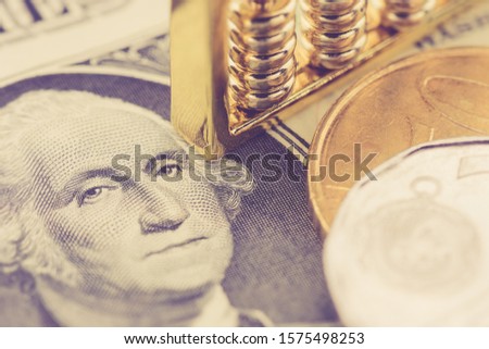 Macro-economics, money supply, currency concept : Chinese abacus on USD dollar banknote with face of US president, depict global infleunce and major impact of the USA FED central bank around the world Royalty-Free Stock Photo #1575498253