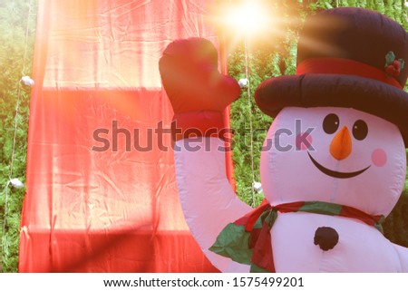 Lovely snowman daytime sun light