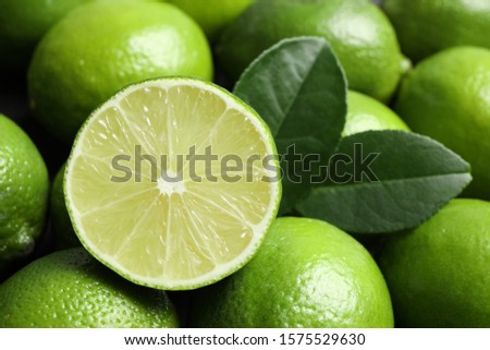 Fresh ripe juicy limes as background, closeup