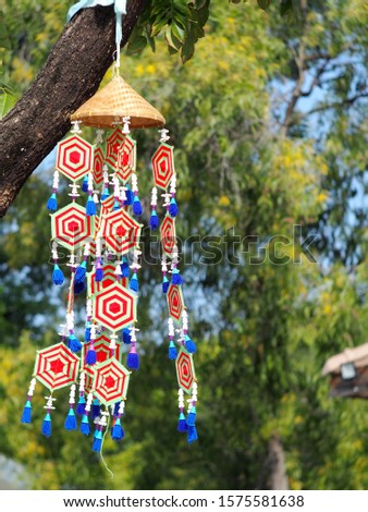 decorative local style hand crafted mobile flags along pathway and art street of KHON KAEN university in KHONKAEN province, THAILAND showing unique decorative style LOIKRATHONG festival