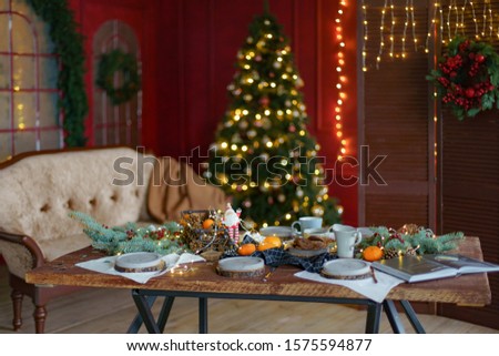 
Festively decorated interior with Christmas tree and garlands