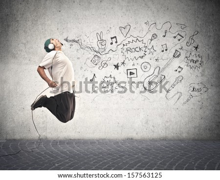 young rapper jumps and listens to music