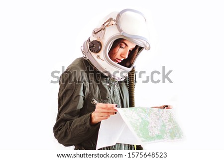 Study map. Astronaut girl in space helmet. Isolated on white background. Young girl in an astronaut suit. Space helmet. Background Wallpaper. Another world. Space people. Cosmic atmosphere. Free space