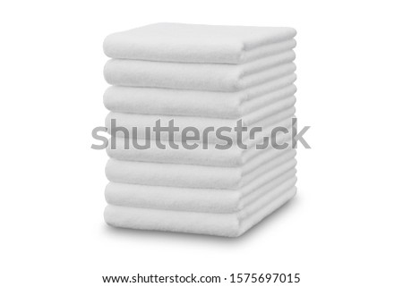 White beach towel on white background Royalty-Free Stock Photo #1575697015