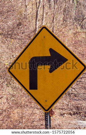 Sharp Right Turn Ahead Caution Directional Arrow Sign Royalty-Free Stock Photo #1575722056