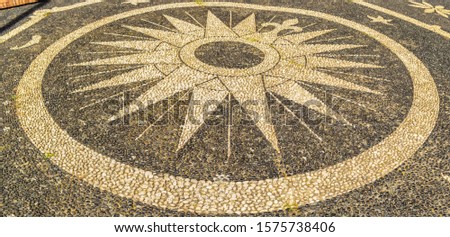 External floor with star decoration made with stones