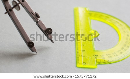 Compass and protractor. Instruments mathematician, architect. Office supplies.