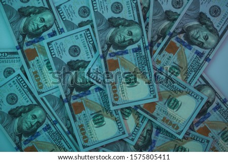 Beautiful Dollars on a table night background. American, US Dollars Cash Money. One Hundred Dollar Banknotes. 