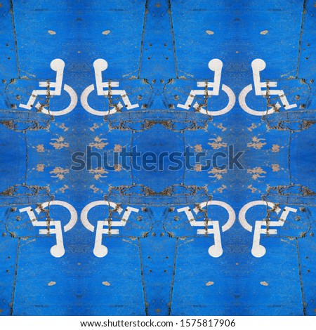 traditional universal icon for disabled access and parking zone white on blue painted surface